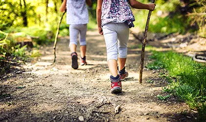 Child hiking on a trail